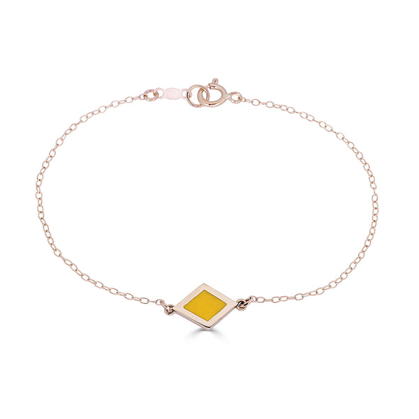 14k gold diamond shaped charm with yellow enamel on delicate chain bracelet