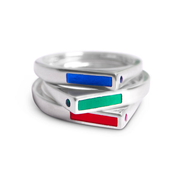 modern stacking rings in blue, red and green enamel, sapphire, emerald and ruby accents