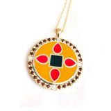 yellow, red and black enameled pendant with gemstone halo