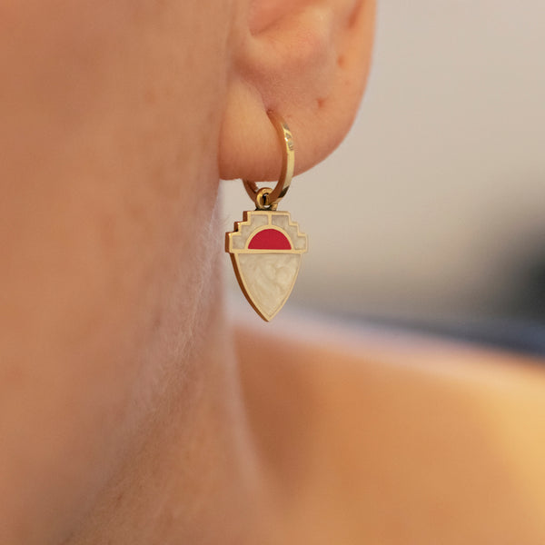 hoop earrings with red and white enamel shield charm drop
