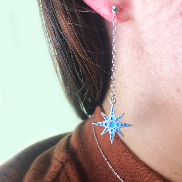 star dangling earrings in blue enamel