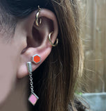 earring stack with pink and silver diamond drop earring and red enameled hexagon posts
